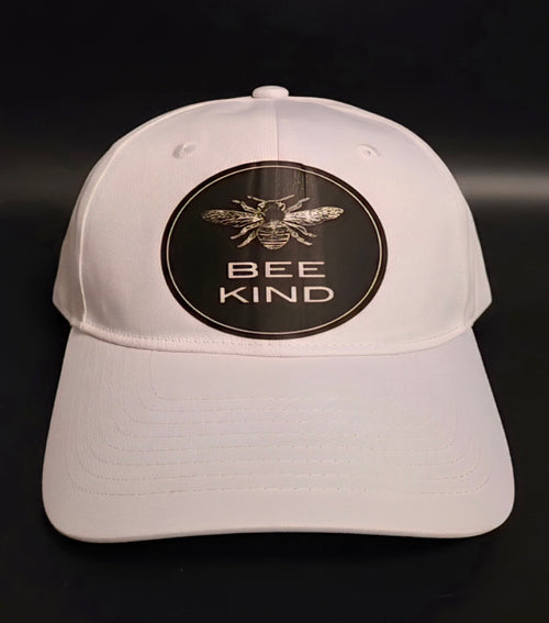 White cap with a honeybee graphic and BEE KIND message