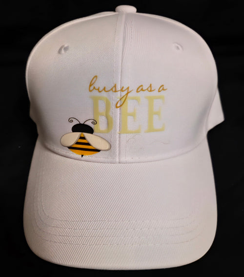 White cap with Busy as a BEE lettering and a honeybee graphic