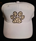 White cap with a neutral polka-dot paw-print graphic