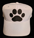 White cap with a bold black paw-print graphic