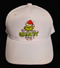 White holiday cap with a green character in a Santa hat and an extra GRINCHY message