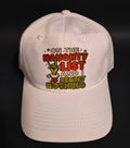 White holiday cap with a naughty list message and green character graphic