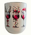 White holiday wine tumbler featuring red wine glasses decorated with reindeer antlers, ornaments, Christmas lights, and a Santa hat.