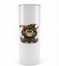 White tumbler featuring a wide-eyed fluffy cat decorated with Christmas greenery, ornaments, a Santa hat and a star