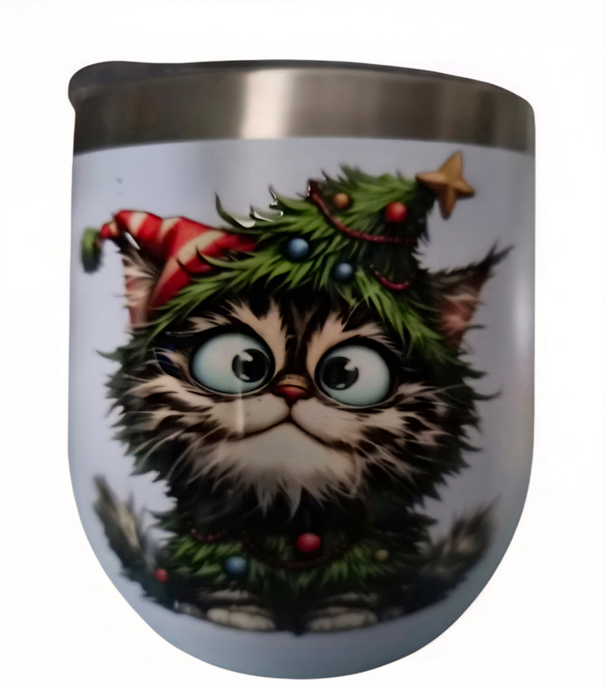 Wide-eyed cat wearing a candy-cane hat and evergreen garland on a white holiday wine tumbler